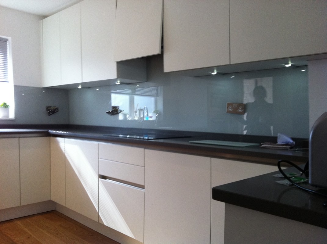 Grey glass kitchen splashback with LED lighting in Canning Town