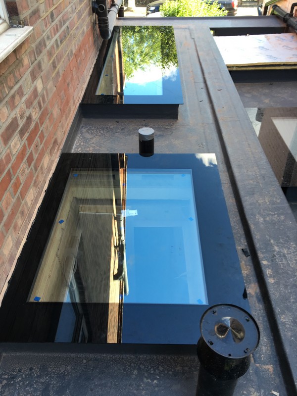 Multiple flat roof skylights on extension in Canning Town